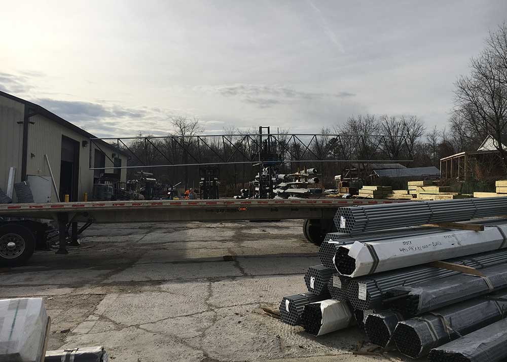placing huge cantilever slide gate on back of truck